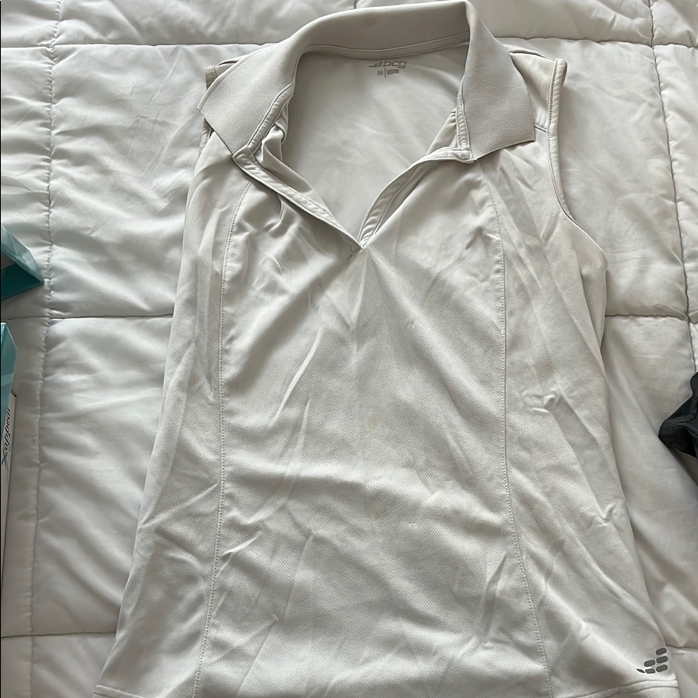 Women’s white sleeveless polo